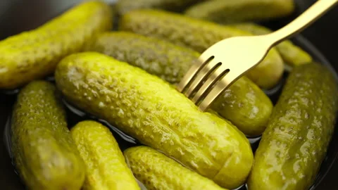 Eating Pickled cucumbers with fork, close up Video stock 235457102