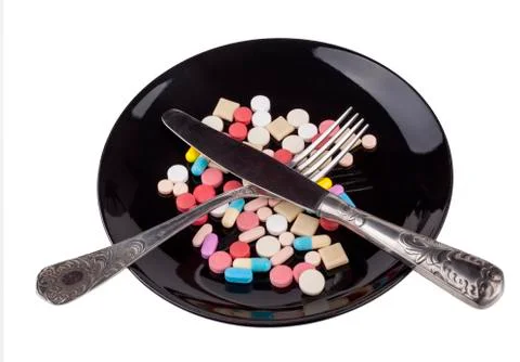 Eating Pills Stock Photos