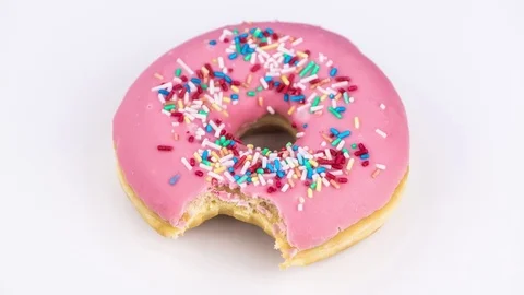 Eating a pink Donut (stop motion footage) Stock Footage 81192478