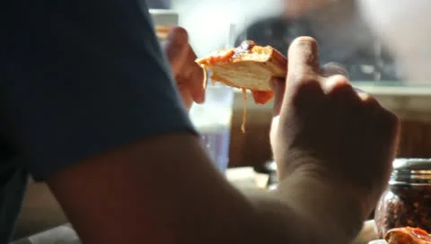 Eating Pizza Slice Stock Footage 11360032