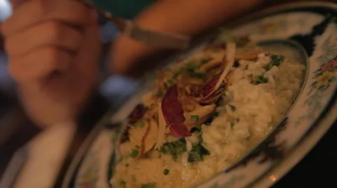Eating a plate of mushroom risotto Stock Footage 42428840