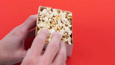 Eating pop corn from box Stock Footage 151923105