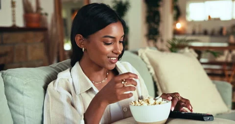 Eating popcorn, watching tv and woman with surprise for streaming service, movie Vídeo Stock 301048129
