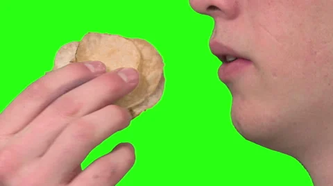 Eating potato chips, green background Stock Footage 49862471