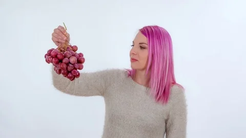 Eating red grapes Stock Footage 83724873