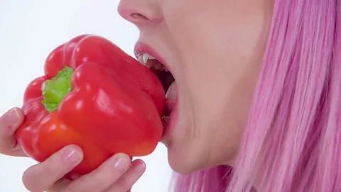 Eating a red pepper Stock Footage 83725806