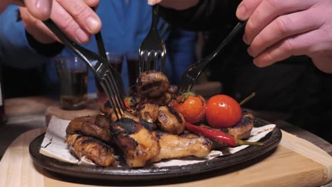 Eating roasted chicken on plate Stock Footage 314908895