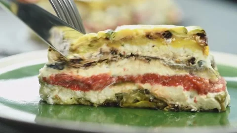 Eating of roasted vegetable terrine, served in a plate. 스톡 동영상 169800085