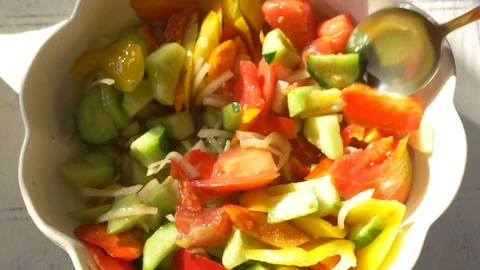 Eating salad with vegetables from a plate. Close-up Stock Footage 80304222