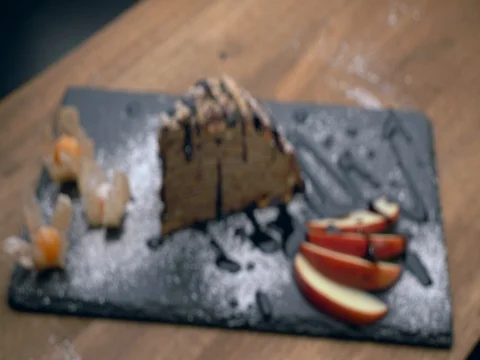 Eating a slice of chocolate cake with folk 動画素材 75710969