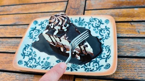 Eating Slice of Chocolate Cheesecake with Fork on Wooden Table Vídeo Stock 332558820
