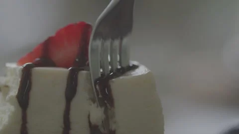 Eating A Slice of Strawberry Cheesecake Stock Footage 208805302