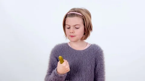 Eating a small pickle Stock Footage 83724843