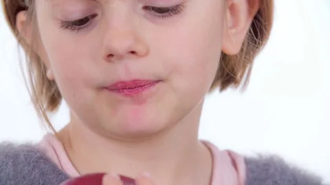 Eating a small red organic apple Stock Footage 83725133
