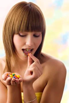 Eating a smarties Foto stock