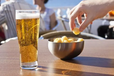 Eating snacks with beer. Stock Photos
