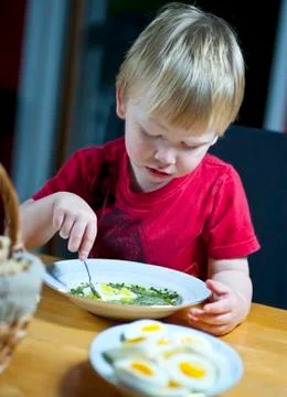 Eating spinach Stock Photos