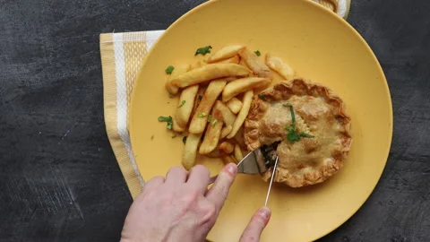 Eating a Steak and Kidney Pie Stock Footage 240325922