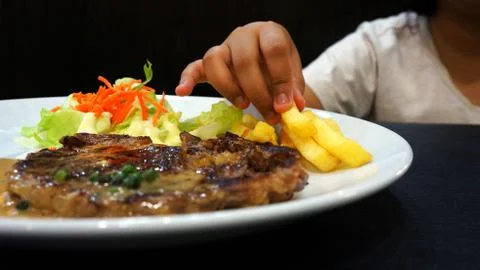 Eating steak Stock Photos