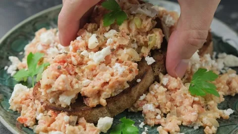 Eating Strapatsada, eggs scrambled with bread, tomatoes and feta cheese. Greek Stock Footage 267076274