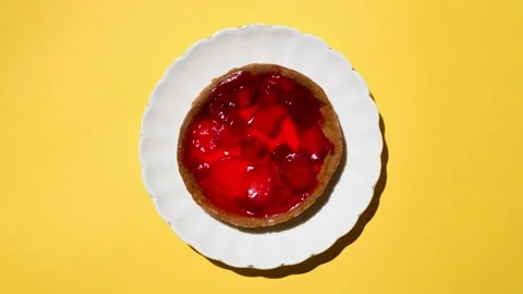 Eating strawberry cheesecake bite by bite, stop motion. Plate of cake moving Stock Footage 145270521
