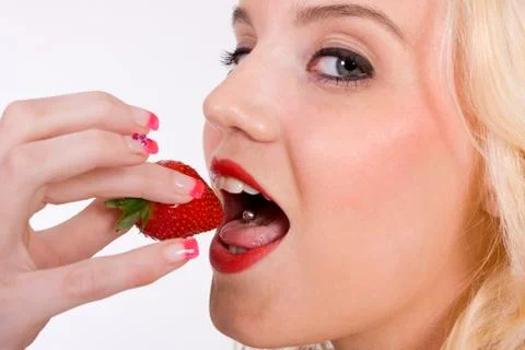 Eating strawberry Stock Photos