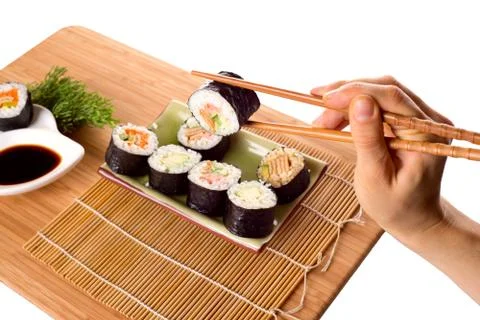 Eating sushi rolls Stock Photos
