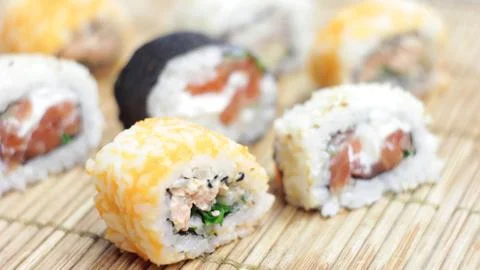Eating Sushi Rolls Stock Photos