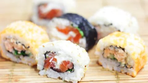 Eating Sushi Rolls Stock Photos