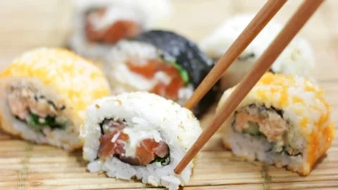 Eating Sushi Rolls Stock Photos
