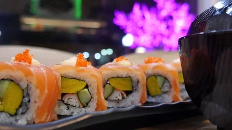 Eating Sushi rolls in a restaurant Stock Footage 64673239