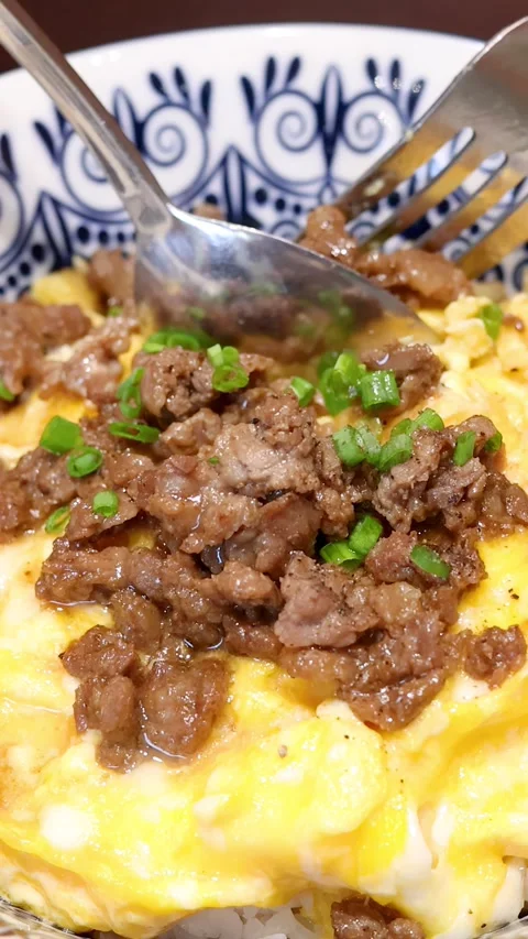 Eating Thai Beef and Egg Rice with Spoon and Fork Stock Footage 314929429