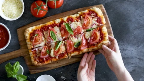 Eating a Tomato and Basil Flatbread Stock Footage 171535133