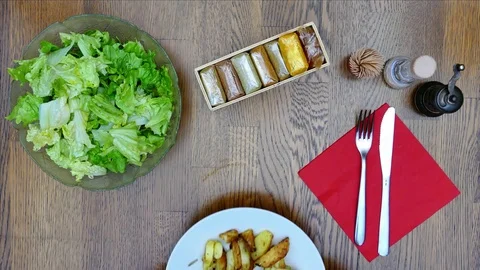 Eating vegan meal on kitchen table. Top view. Video stock 72878570