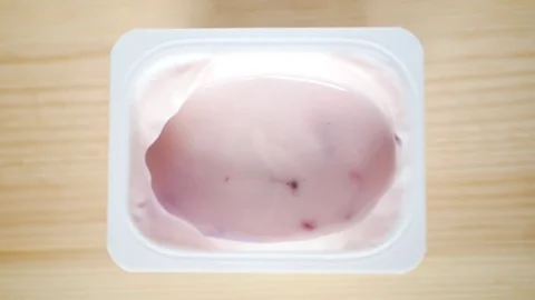 Eating yogurt with berries. Stock Footage 70516378