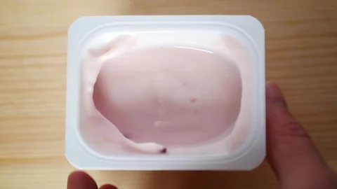Eating yogurt with berries. Stock Footage 70516410