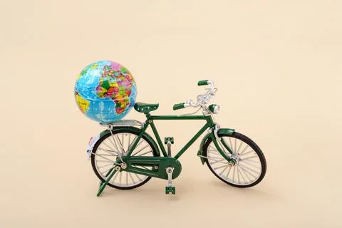 Eatrh globe on a green bicycle Stock Photos