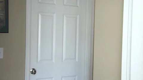 Eavesdropping Against Door Couple Stock Footage