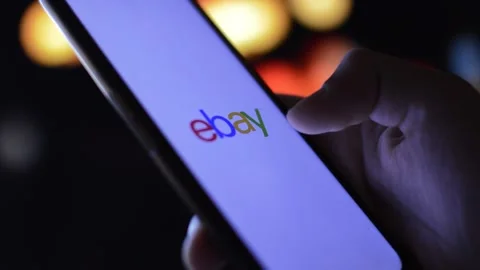 Ebay logo icon on a phone in a night city blurred background Stock Footage 201665113