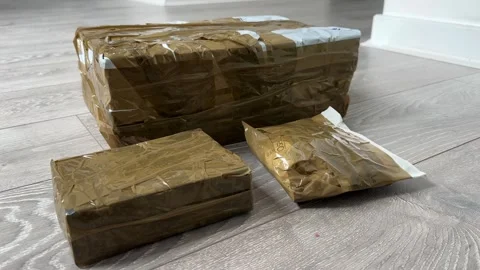 Ebay parcels wrapped Close Up of Cardboard Packages Wrapped with Duct Tape for 스톡 동영상 318220265