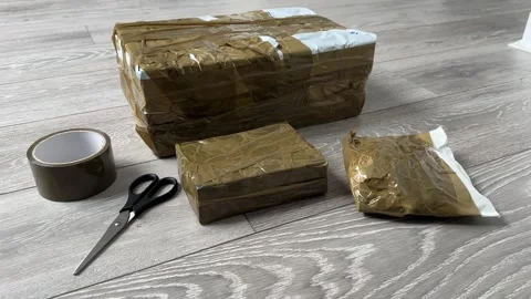 Ebay parcels wrapped Close Up of Cardboard Packages Wrapped with Duct Tape for 스톡 동영상 318276330
