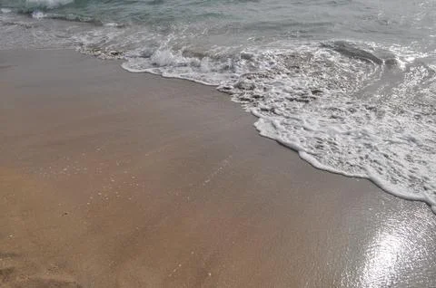 Ebb and flow by the sea Stock Photos