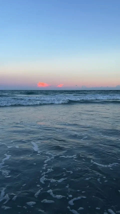 The ebb and flow of the tide on the sea or ocean shore. The movement of water on Stock Footage 325684816