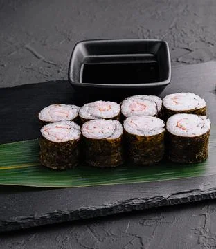 Ebi maki - sushi roll with shrimps on black board Stock Photos