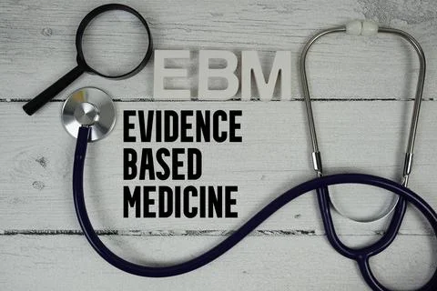 EBM Evidence-based Medicine text with Stethoscope on wooden background Stock Photos