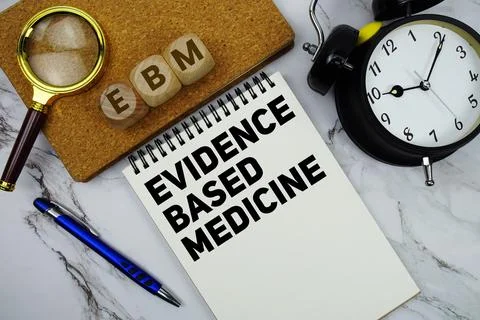 EBM Evidence Based Medicine text written on notepad with calculator and mag.. Stock Photos