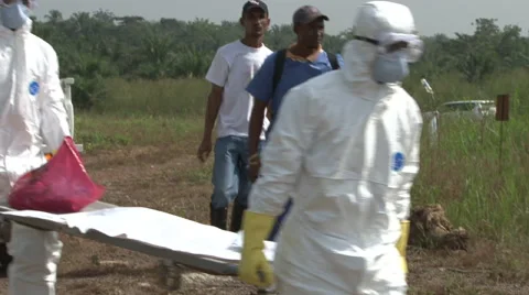 Ebola graves body carried to graveside Stock Footage