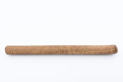Ebonite stick on white background. Also is known as hard rubber or vulcanite Fotos Stock