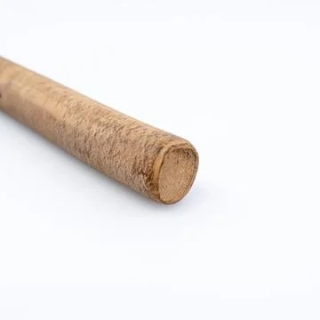 Ebonite stick on white background. Also is known as hard rubber or vulcanite Stock Photos
