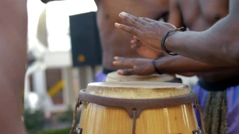 Ebony afro americans plays on ethnic bamboo drums Stock Footage 102653349